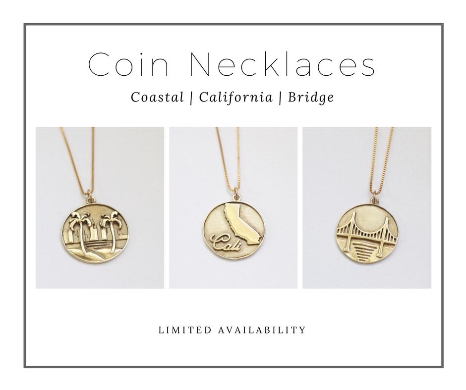 Three gold coin necklaces representing the coast, California and San Francisco Bridge